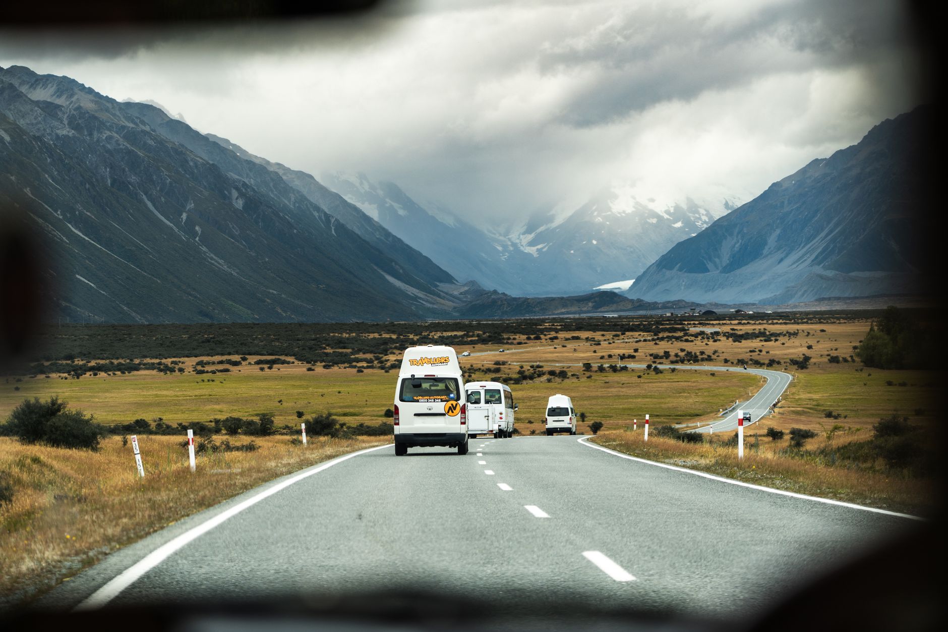 Campervan parked next to mountain lake in New Zealand