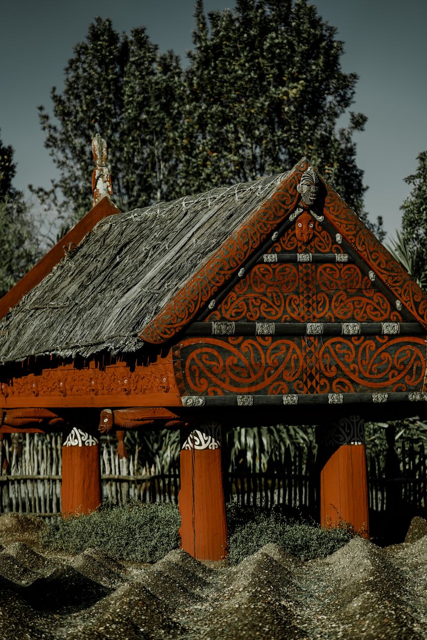 Traditional Maori carved meeting house Marae exterior